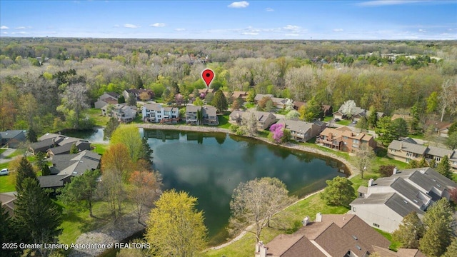 2454 Emerald Lake Dr, East Lansing, MI 48823 - aerial view featuring a residential view, a view of trees, and a water view