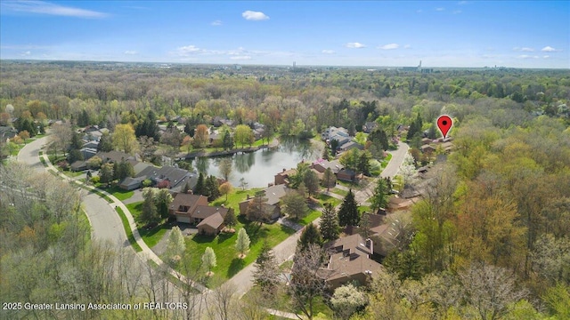 2454 Emerald Lake Dr, East Lansing, MI 48823 - bird's eye view featuring a residential view, a water view, and a wooded view