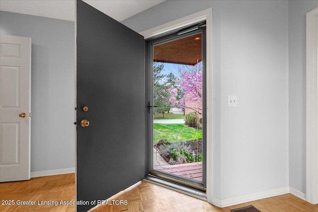 2454 Emerald Lake Dr, East Lansing, MI 48823 - foyer entrance featuring baseboards and visible vents