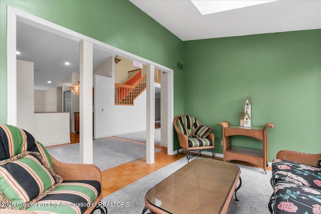 2454 Emerald Lake Dr, East Lansing, MI 48823 - living area with visible vents, a skylight, stairway, baseboards, and recessed lighting