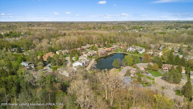 2454 Emerald Lake Dr, East Lansing, MI 48823 - drone / aerial view featuring a water view, a residential view, and a wooded view