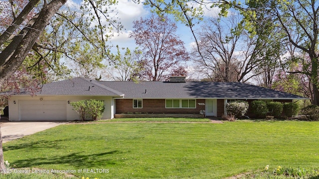 ranch-style home featuring an attached garage, a front lawn, driveway, and brick siding