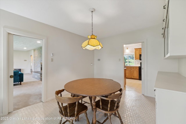 dining room with recessed lighting, baseboards, and light tile patterned floors
