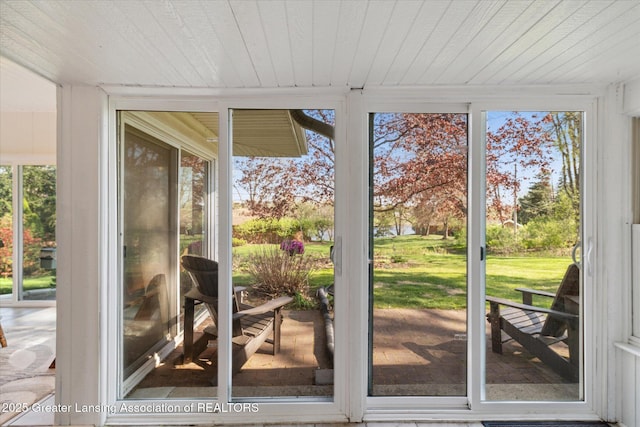 doorway to outside with wood ceiling
