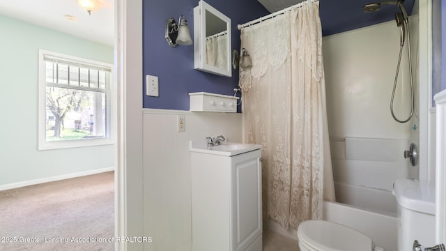 bathroom featuring vanity, shower / bath combination with curtain, and toilet