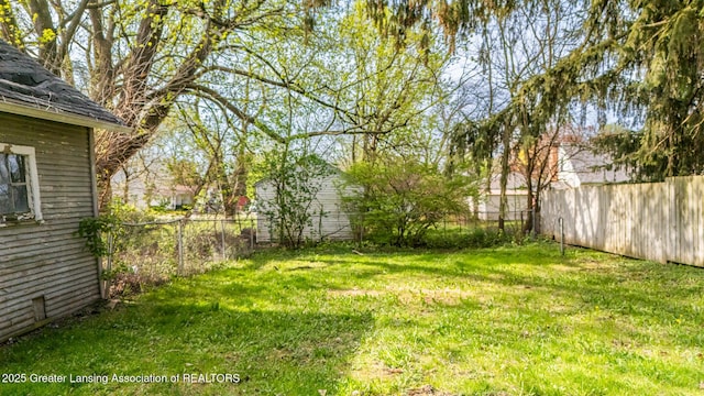 view of yard with a fenced backyard