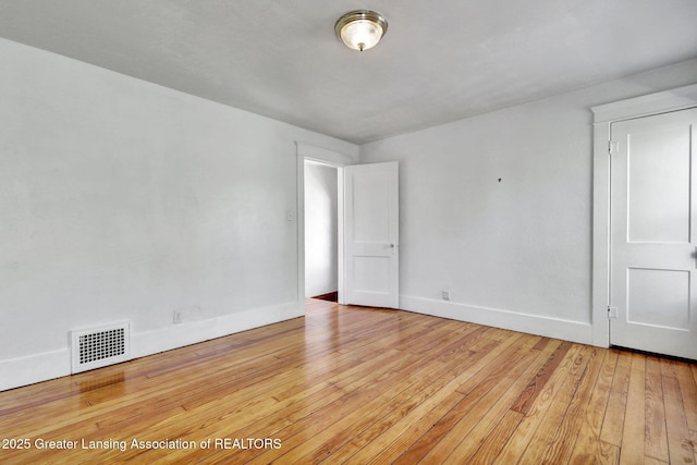 223 N Fairview, Lansing, MI 48912 - empty room featuring baseboards, light wood finished floors, and visible vents
