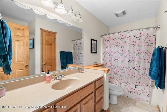 bathroom with toilet, visible vents, shower / tub combo with curtain, and vanity