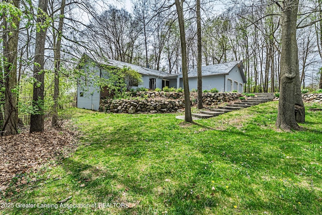 view of yard featuring a garage