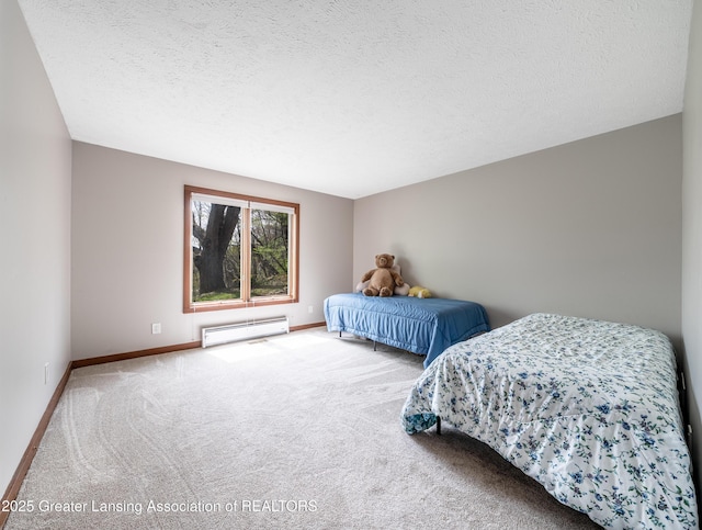carpeted bedroom featuring baseboards, a textured ceiling, and baseboard heating