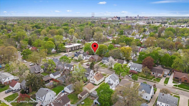 birds eye view of property with a residential view