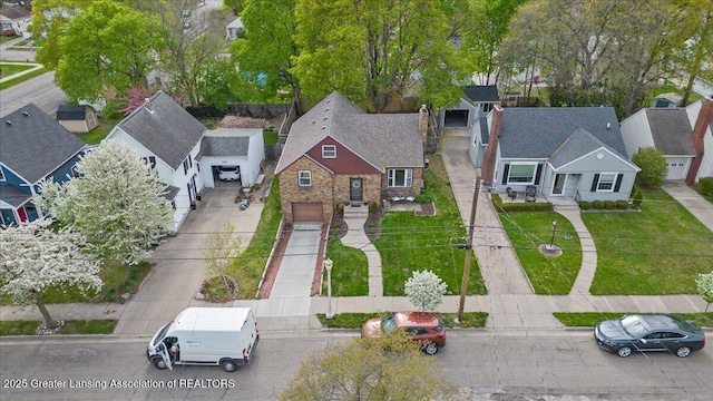 birds eye view of property with a residential view