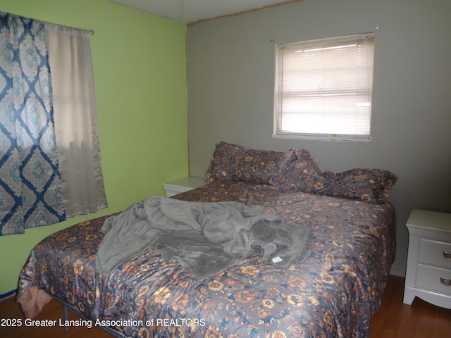 bedroom with wood finished floors