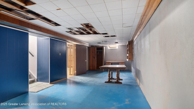 game room featuring finished concrete flooring