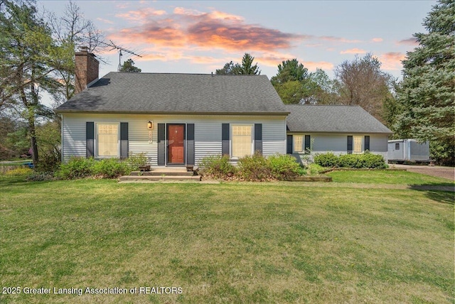 12188 Forest Meadow Dr, Perry, MI 48872 - view of front of home with a chimney and a front yard
