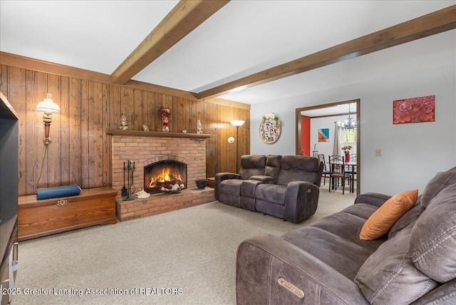 12188 Forest Meadow Dr, Perry, MI 48872 - carpeted living area with a brick fireplace, a chandelier, wood walls, and beam ceiling