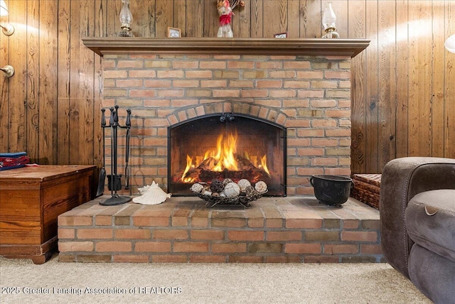 12188 Forest Meadow Dr, Perry, MI 48872 - room details with carpet floors, a brick fireplace, and wooden walls