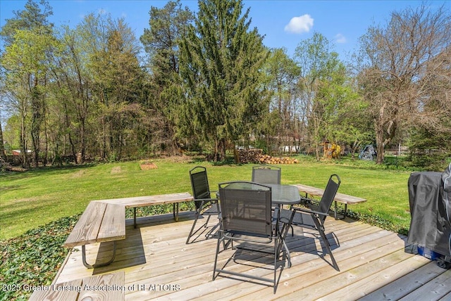12188 Forest Meadow Dr, Perry, MI 48872 - wooden deck featuring outdoor dining area and a yard