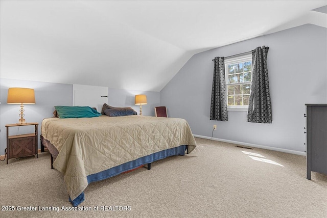12188 Forest Meadow Dr, Perry, MI 48872 - carpeted bedroom with baseboards, vaulted ceiling, and visible vents
