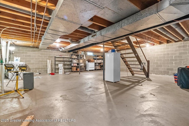 12188 Forest Meadow Dr, Perry, MI 48872 - unfinished basement with stairs and concrete block wall