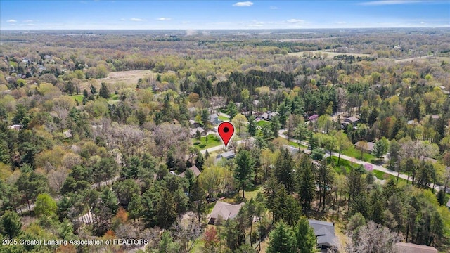 12188 Forest Meadow Dr, Perry, MI 48872 - birds eye view of property featuring a wooded view
