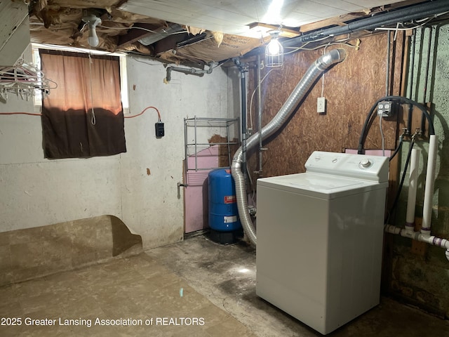 unfinished basement featuring washer / clothes dryer