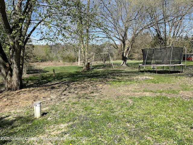 view of yard featuring a trampoline