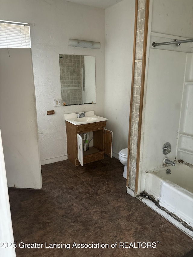 bathroom with vanity, shower / bathtub combination, and toilet