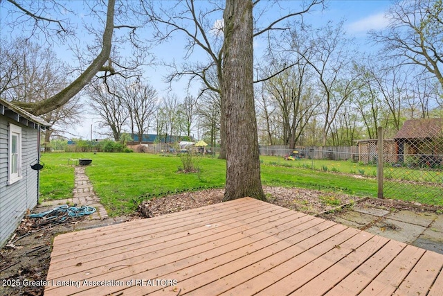 2035 Mary Ave, Lansing, MI 48910 - wooden terrace featuring a fenced backyard and a yard