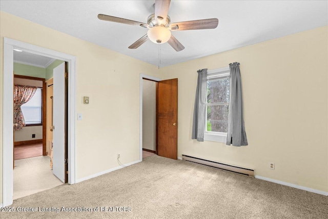 2035 Mary Ave, Lansing, MI 48910 - unfurnished bedroom with baseboards, a baseboard heating unit, and light carpet
