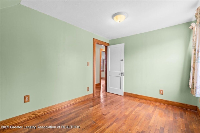 2035 Mary Ave, Lansing, MI 48910 - empty room with baseboards and wood finished floors