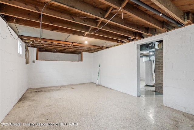 2035 Mary Ave, Lansing, MI 48910 - below grade area featuring water heater and concrete block wall