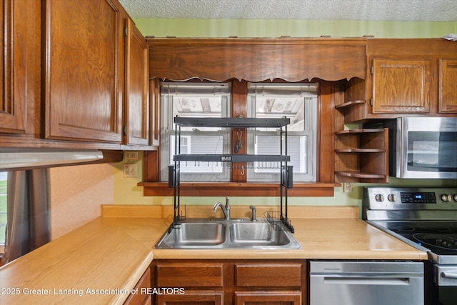 kitchen with open shelves, plenty of natural light, light countertops, a sink, and stainless steel appliances