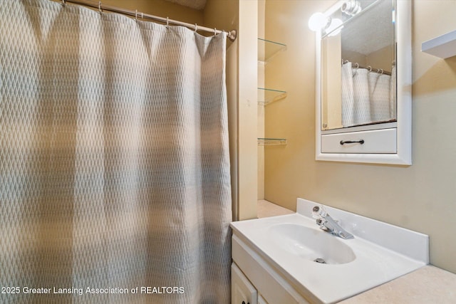 full bathroom featuring vanity and a shower with curtain