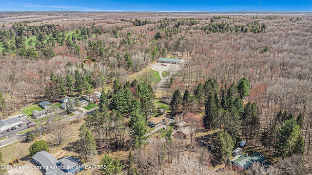 111 Terrace Dr, Houghton Lake, MI 48629 - aerial view of property and surrounding area featuring a heavily wooded area