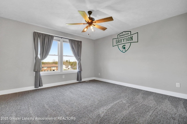 empty room featuring carpet flooring, ceiling fan, and baseboards