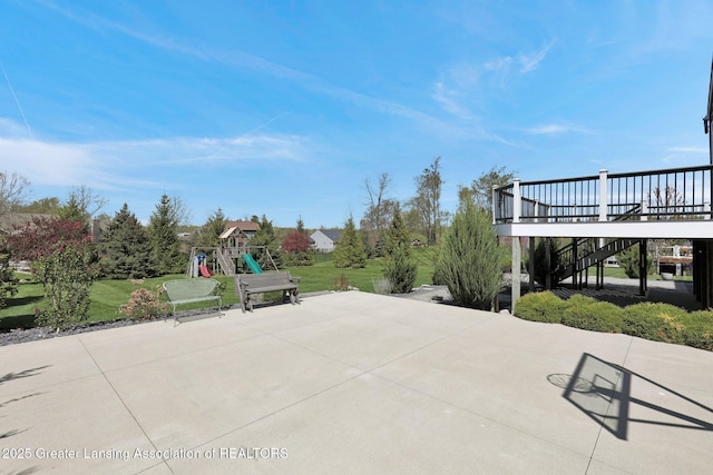 view of patio / terrace featuring a playground and stairway