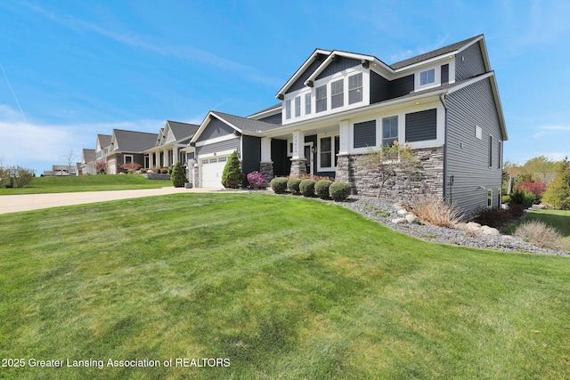 craftsman inspired home with driveway, a front lawn, stone siding, and a garage