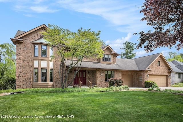 3796 Viceroy Dr, Okemos, MI 48864 - view of front of property with a garage, brick siding, and a front lawn