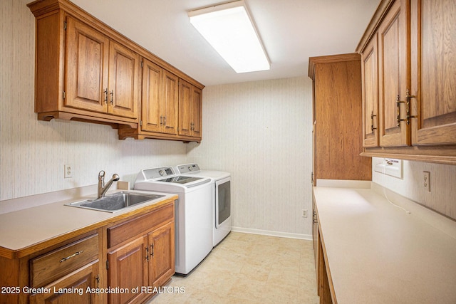 3796 Viceroy Dr, Okemos, MI 48864 - laundry area featuring washer and clothes dryer, cabinet space, and light flooring