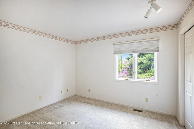 3796 Viceroy Dr, Okemos, MI 48864 - unfurnished room with light colored carpet and baseboards