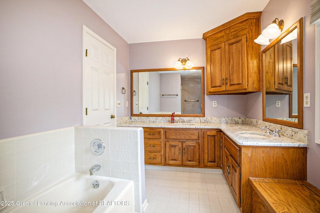 3796 Viceroy Dr, Okemos, MI 48864 - bathroom with a bath, double vanity, and tile patterned flooring