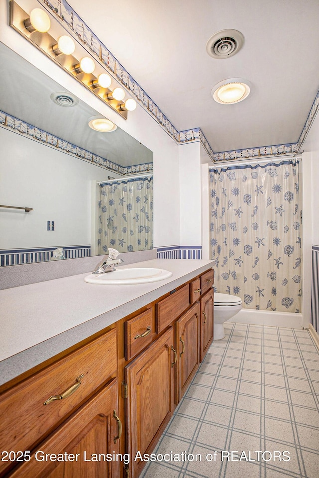 3796 Viceroy Dr, Okemos, MI 48864 - bathroom with vanity, toilet, curtained shower, and tile patterned floors