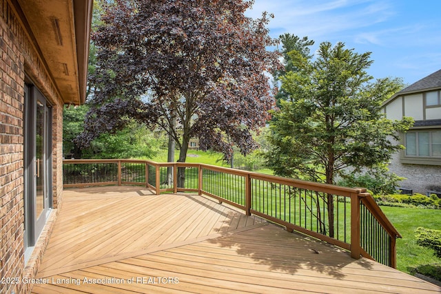 3796 Viceroy Dr, Okemos, MI 48864 - wooden deck featuring a lawn