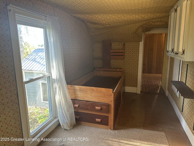 kitchen featuring plenty of natural light, light wood finished floors, and wallpapered walls