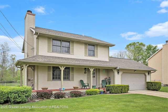 11190 Cobblestone Ln, Grand Ledge, MI 48837 - traditional-style house featuring covered porch, an attached garage, concrete driveway, a chimney, and roof with shingles