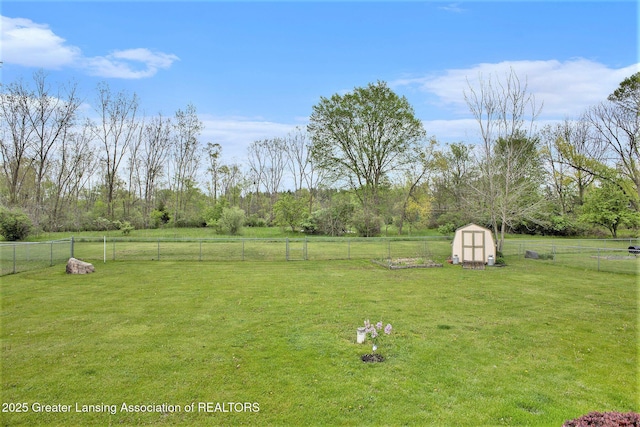 11190 Cobblestone Ln, Grand Ledge, MI 48837 - view of yard featuring a storage shed, an outdoor structure, and a view of countryside