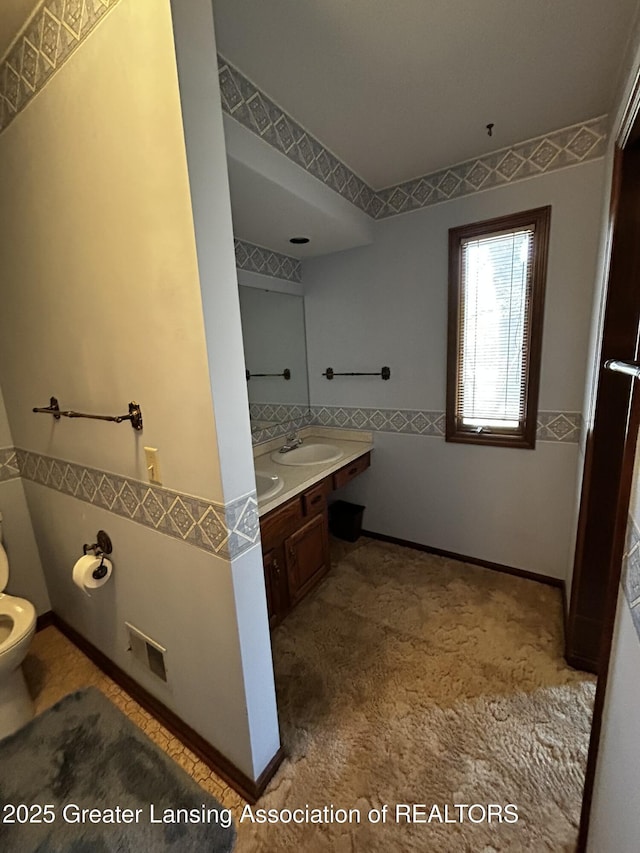 9466 W Grand River Ave, Grand Ledge, MI 48837 - full bath featuring double vanity, a sink, and toilet