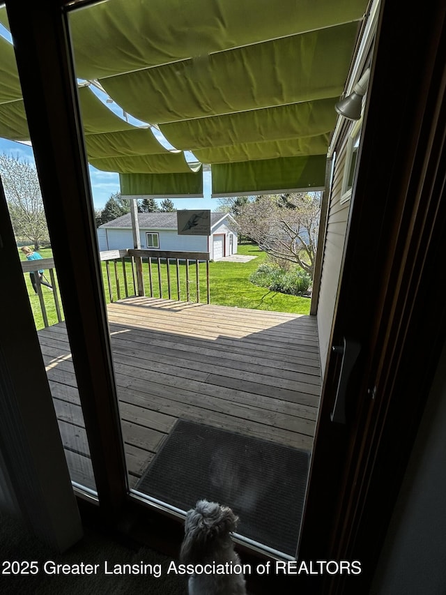 9466 W Grand River Ave, Grand Ledge, MI 48837 - deck featuring a lawn and an outbuilding