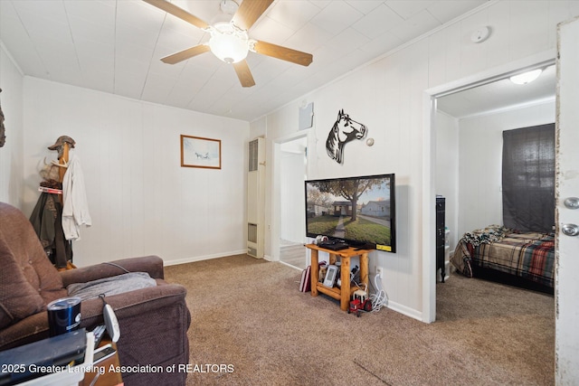 4125 Lowcroft Ave, Lansing, MI 48910 - carpeted living room featuring crown molding, a ceiling fan, and a heating unit
